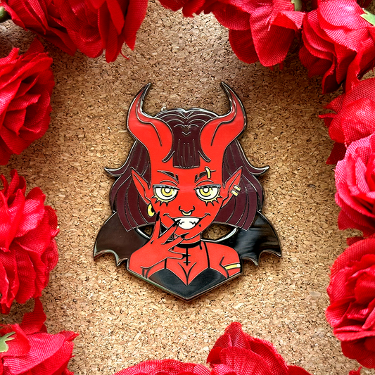 El pin de esmalte del demonio