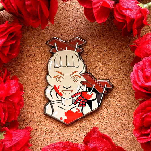 El pin esmaltado de la marioneta